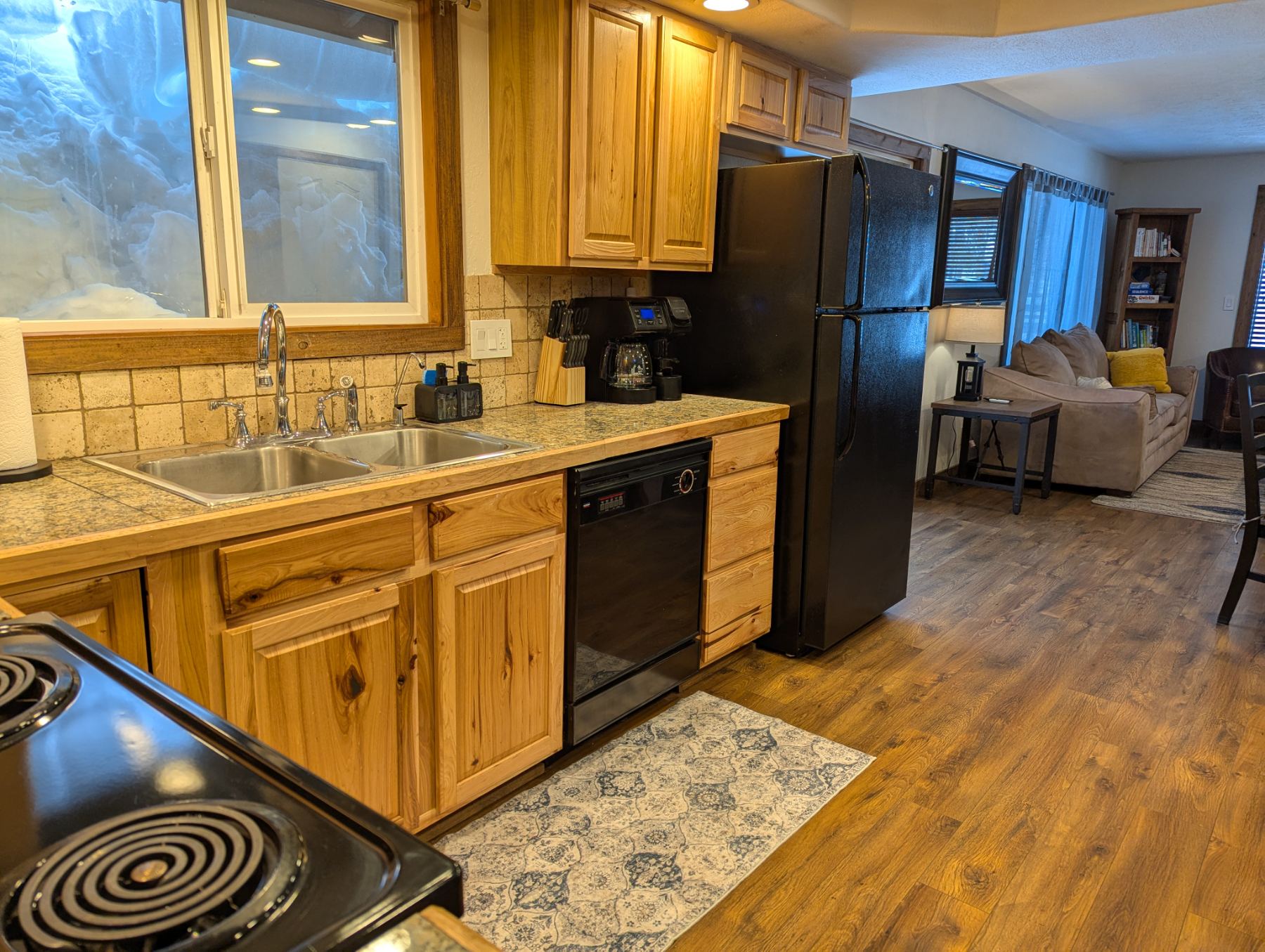 Kitchen in winter with snow piled against the window